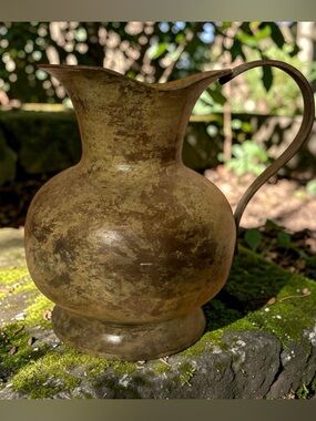 Rustic metal pitcher